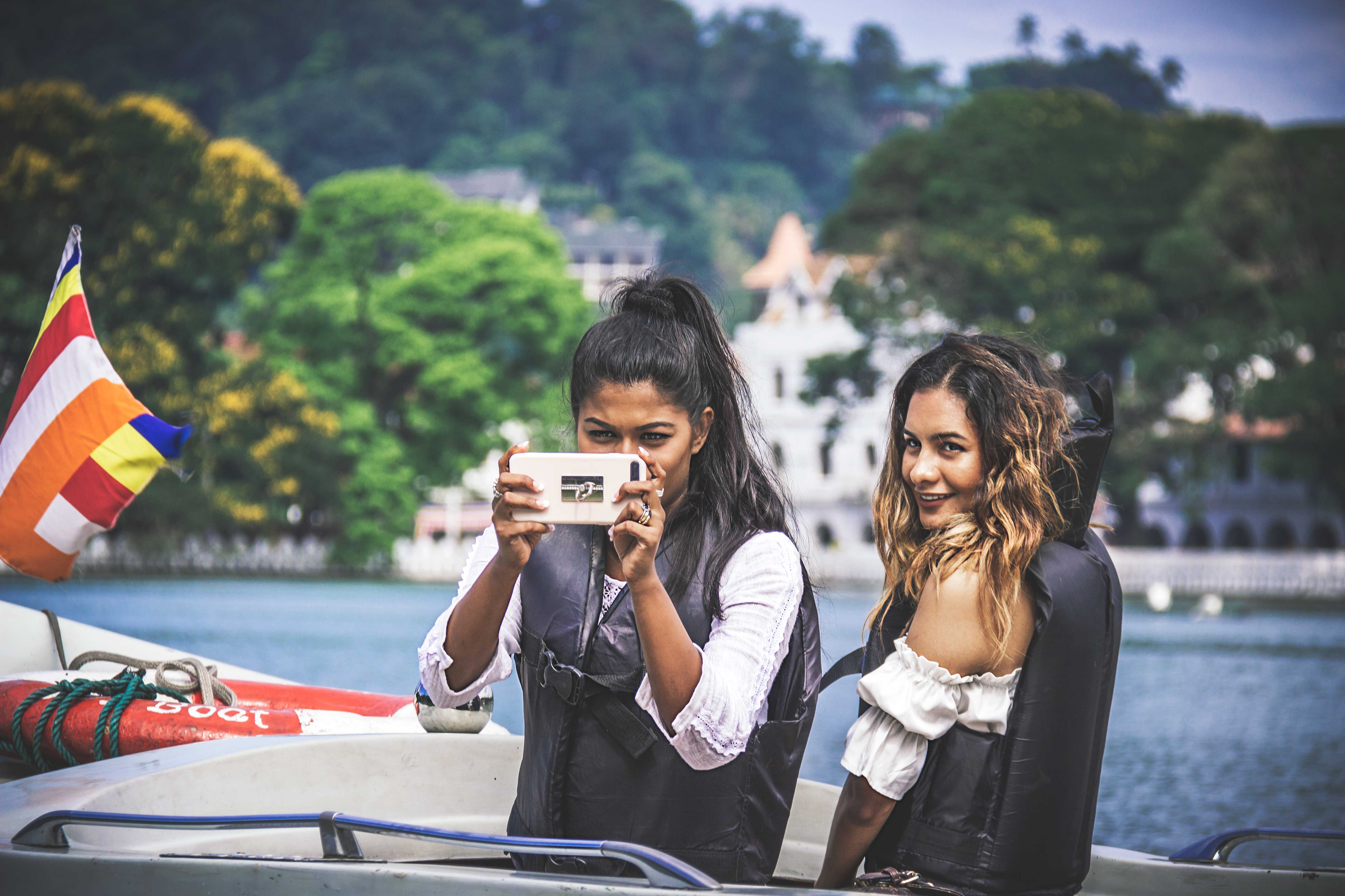 img_6341b Anuradha Perera and Shermaine Willis shooting with phone on boat.